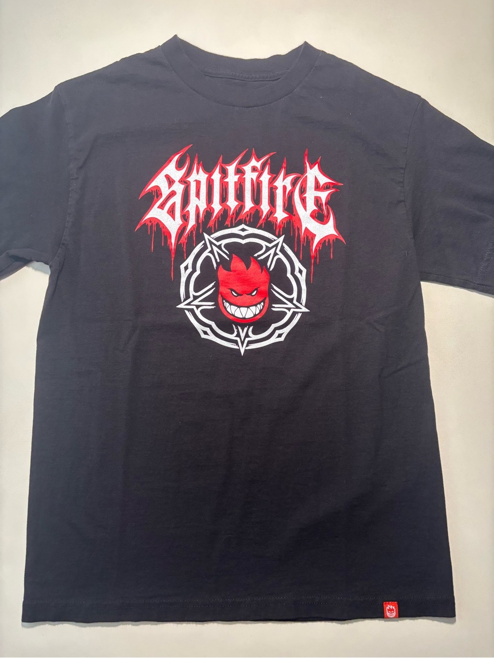 Spitfire skater style Y2K black, white, and red graphic shirt grunge symbol